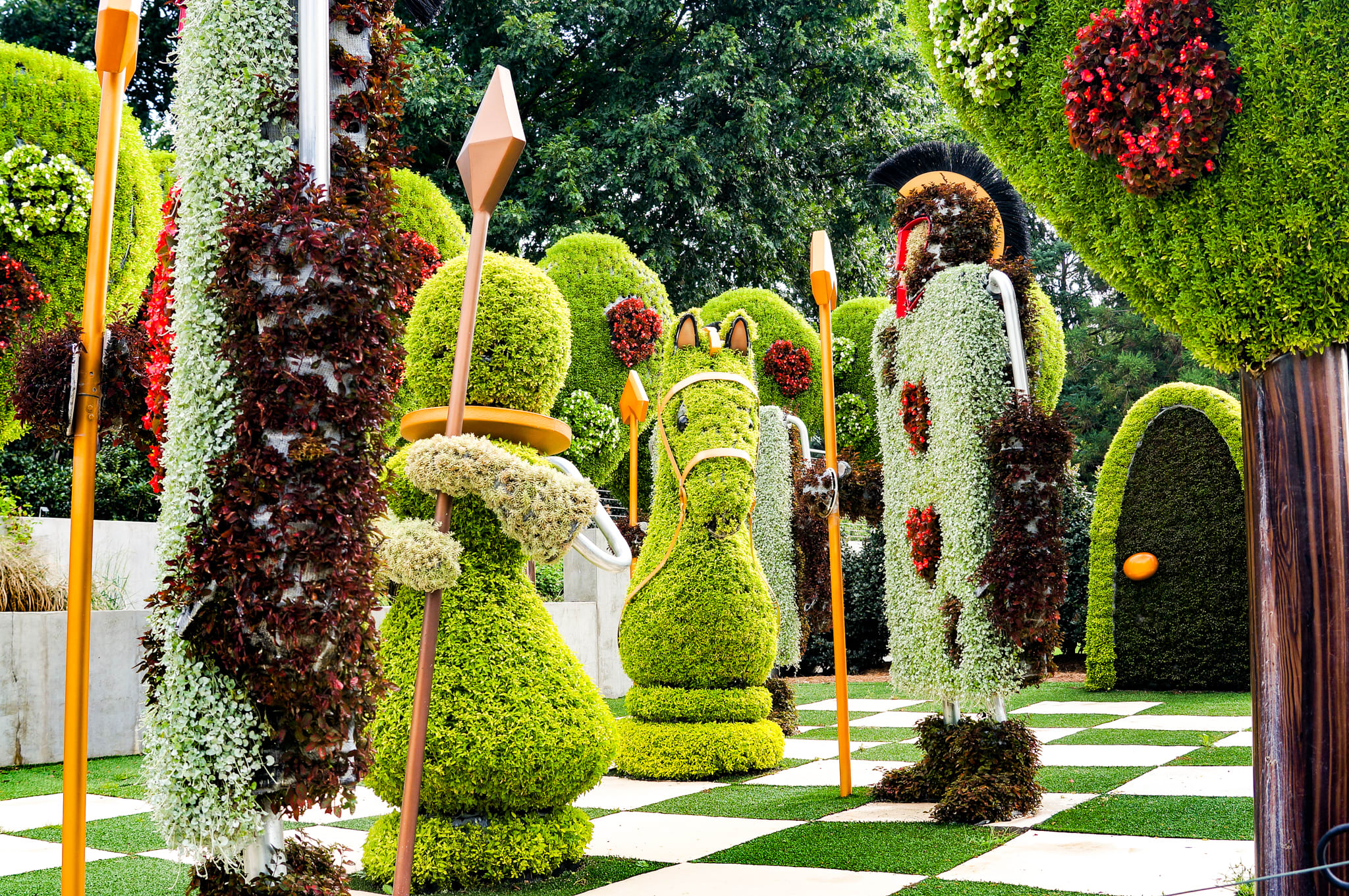 Enormous topiary sculptures of a chess set as part of Alice in Wonderland Reimagined at Atlanta Botanical Garden